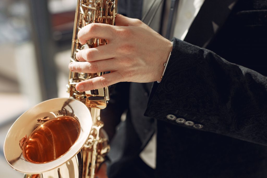 person experiencing benefits of music on saxophone