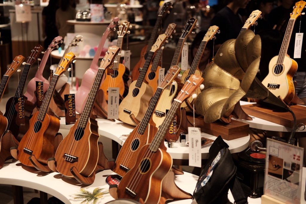 different ukuleles on display at a store