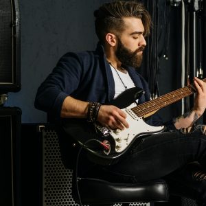 musician with guitar and amp