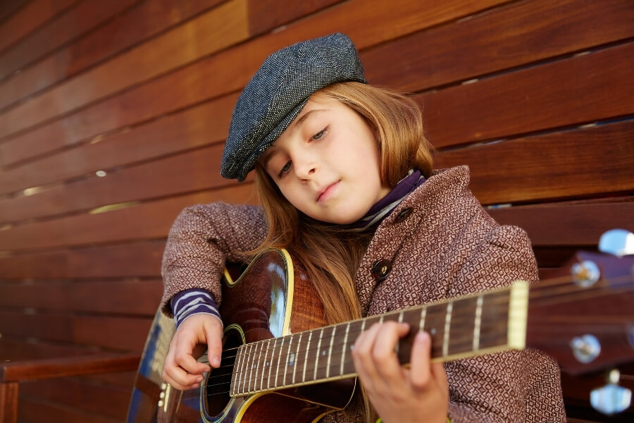 A girl playing guitar