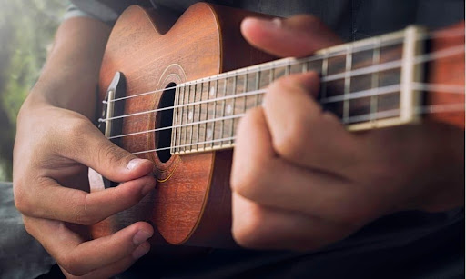 A man plays during ukulele