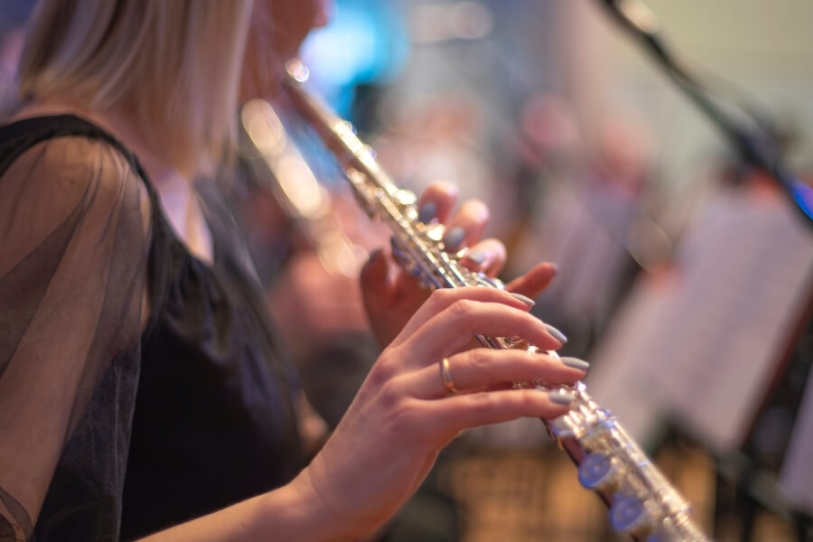 Woman Playing Woodwind instrument